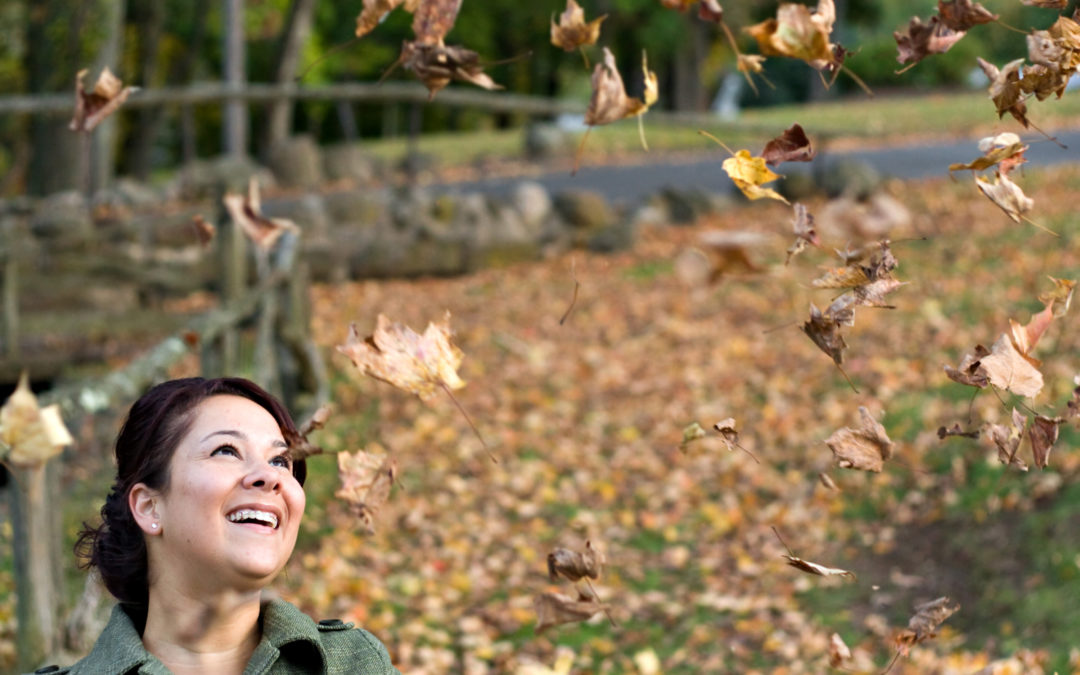 Woman laughing during fall preparations